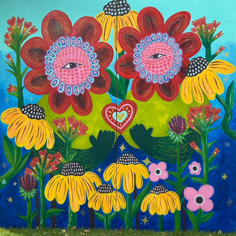 Coming Together, Growing Together - Mural for OKC Fresh Paint Mural Project Two figures with bright red flowers for faces sit in a field of Oklahoma wildflowers.